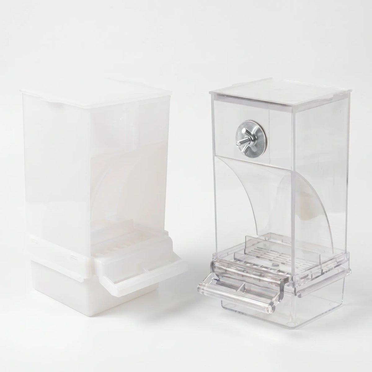 Frosted white and clear feeders shown at a slight angle, revealing the metal bolt, curved seed guide, perch tray and hinged lid. 4