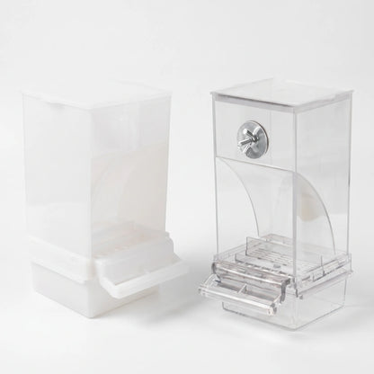 Frosted white and clear feeders shown at a slight angle, revealing the metal bolt, curved seed guide, perch tray and hinged lid. 4