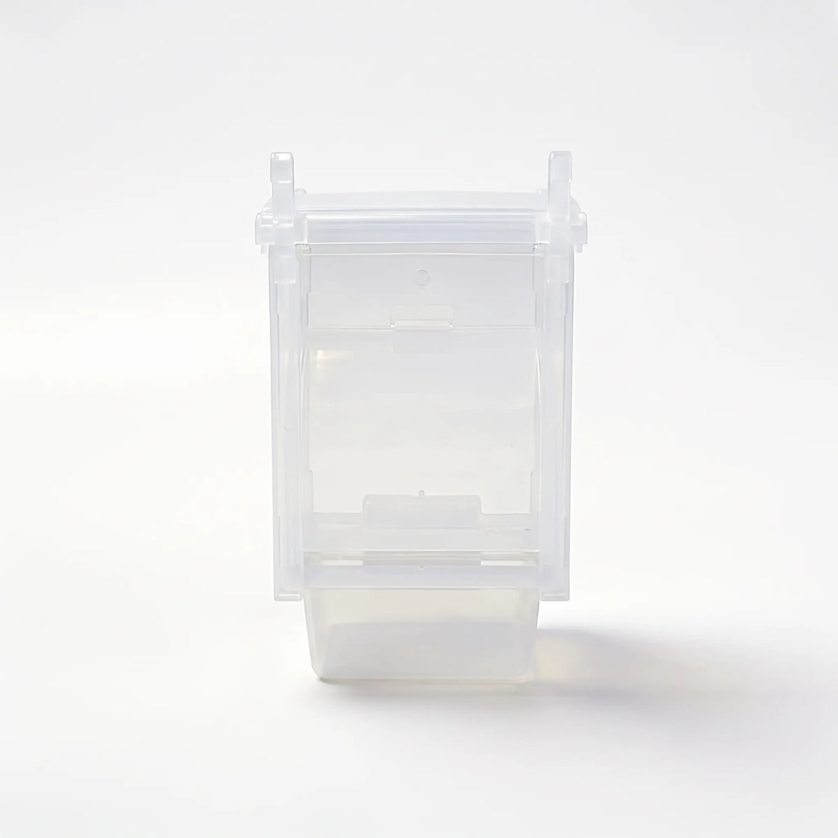Empty transparent plastic seed feeder with hanging hooks at the top and a tray at the base, shown against a plain white background. 1