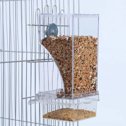 Clear seed feeder filled with mixed bird seed, hung on a wire cage with a metal wing-nut fixing and a tray below. 1