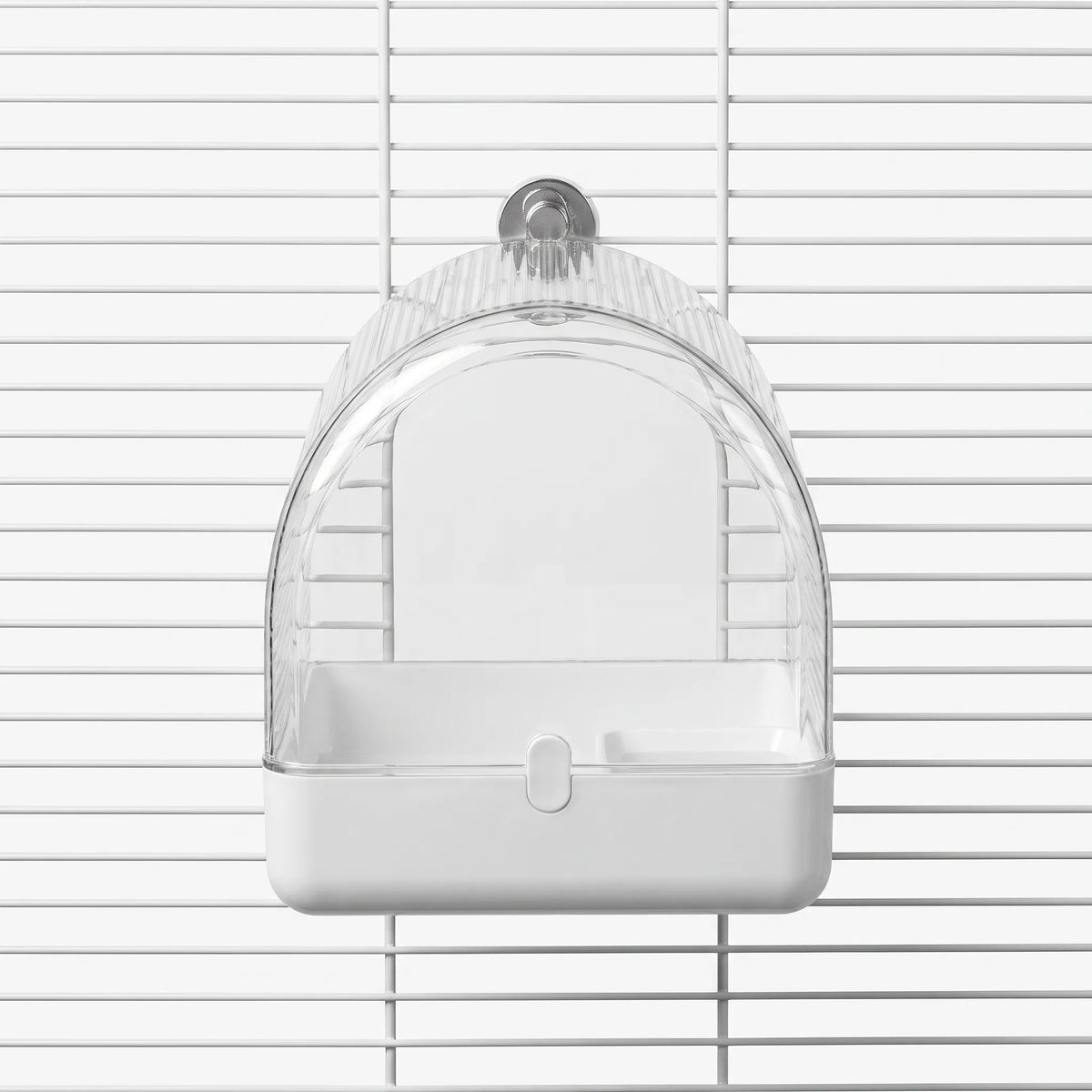 Front view of the clear arched bath with a white base, hung on white cage wires by a round mount. 1