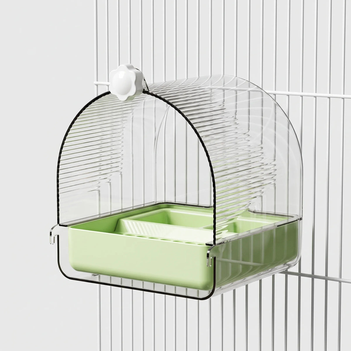 Version with a pale green tray, hung on white cage bars with its flower-shaped knob and clear ribbed dome. 6