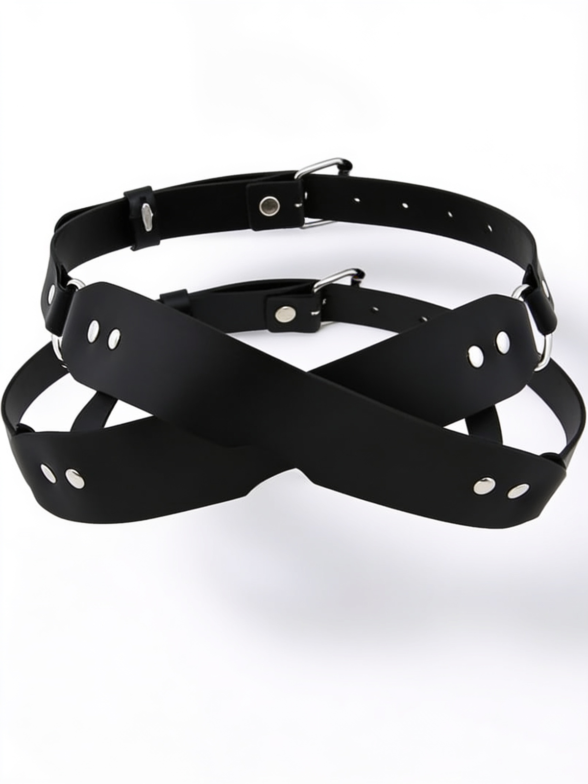 Black crossed-strap blindfold with silver rivets, D-rings and two adjustable buckled straps, shown flat on white 1