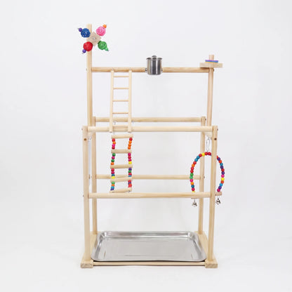 Front view of the wooden multi-level playstand on a plain white background, with rope ladder, beaded swing, steel food cup and metal tray. 1