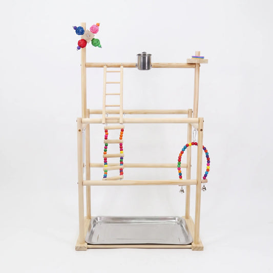 Front view of the wooden multi-level playstand on a plain white background, with rope ladder, beaded swing, steel food cup and metal tray. 1