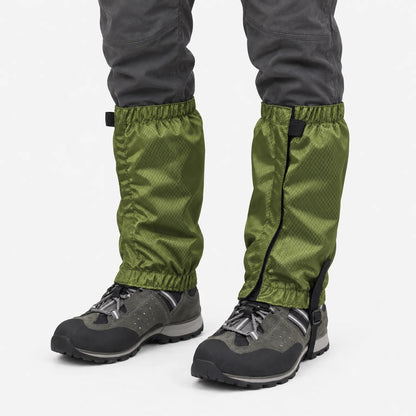 Olive green ripstop gaiters with elastic tops and hems, worn over grey hiking boots, shown against a plain white background. 2