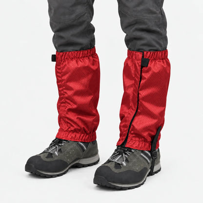 Red ripstop gaiters with elastic tops and hems, worn over grey hiking boots and dark trousers against a white background. 7