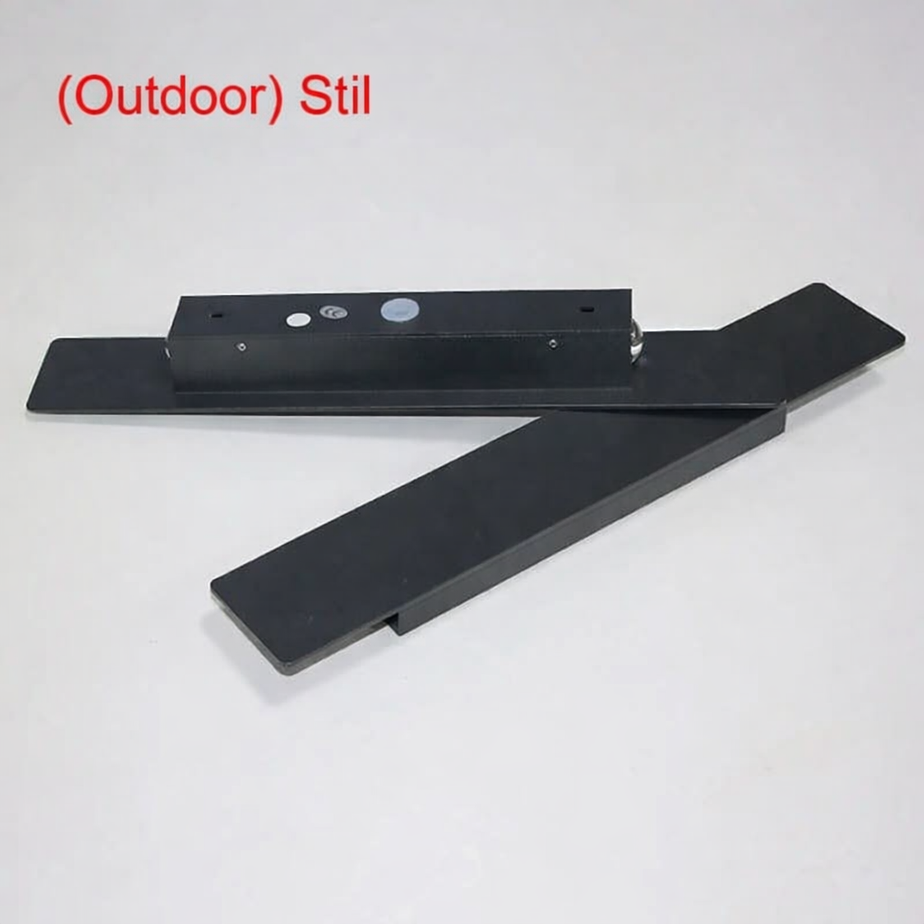 Black light unit with its mounting plate and separate cover plate laid on a plain grey surface, showing the back and fixings. 5