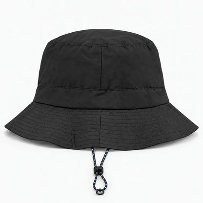 Black bucket hat seen from the side-back with a stitched brim and a short drawcord with toggle and ring at the front. 11
