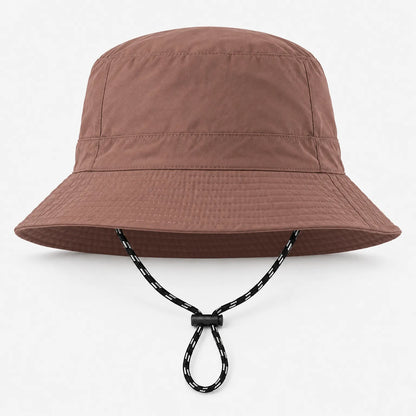 Front view of the brown bucket hat with a stitched brim and a black-and-white drawcord with toggle looped beneath. 9