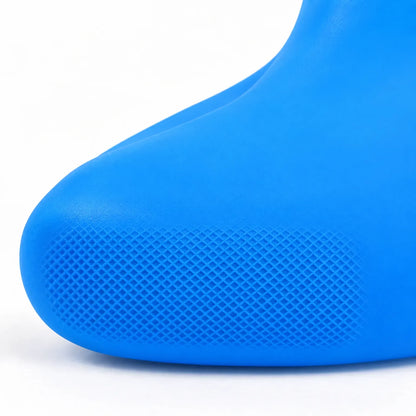 Close-up of the toe of a blue shoe cover, showing the small diamond-patterned non-slip texture on the rubbery surface. 6