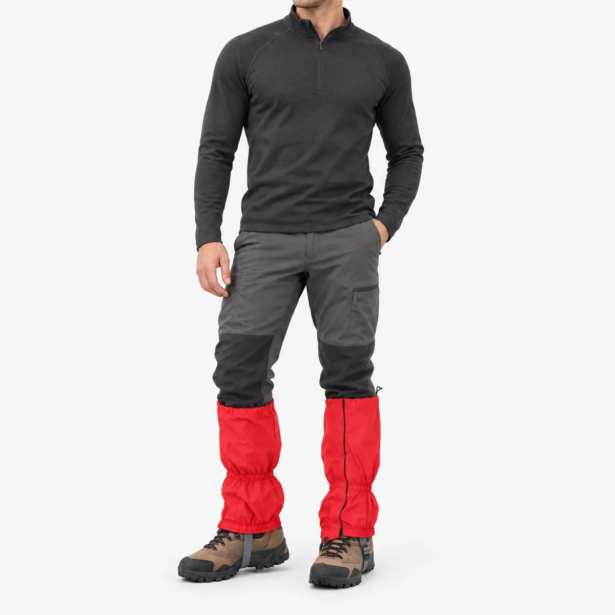 Full-length studio shot of a man in red gaiters worn over grey walking trousers and brown hiking boots, front view. 2