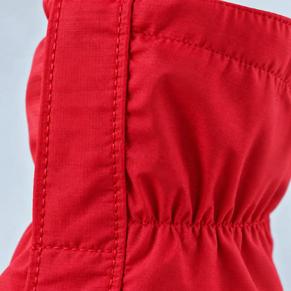 Extreme close-up of the red ripstop fabric, showing the stitched seam and gathered elastic section of the gaiter. 6