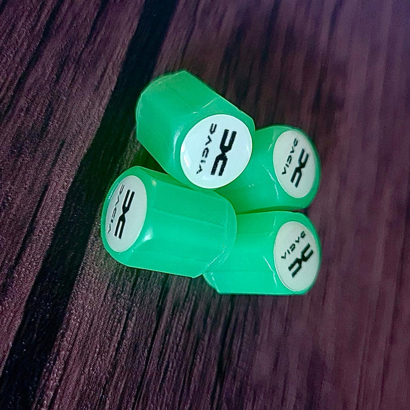 Set of 4 Glow-in-the-Dark Valve Caps with Logo – LuxaGlow