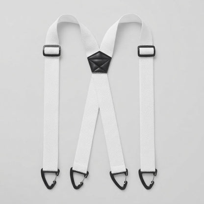 Flat lay of white X-shape braces with four clip hooks, slide adjusters and a black centre patch 9