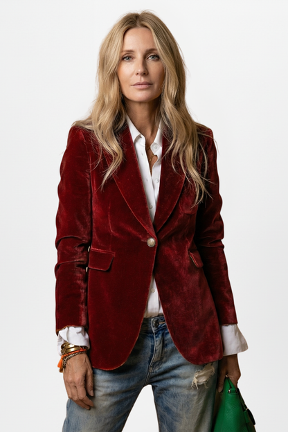 Model wearing the blazer in a deep red crushed velvet, with white shirt, jeans and bracelets 7