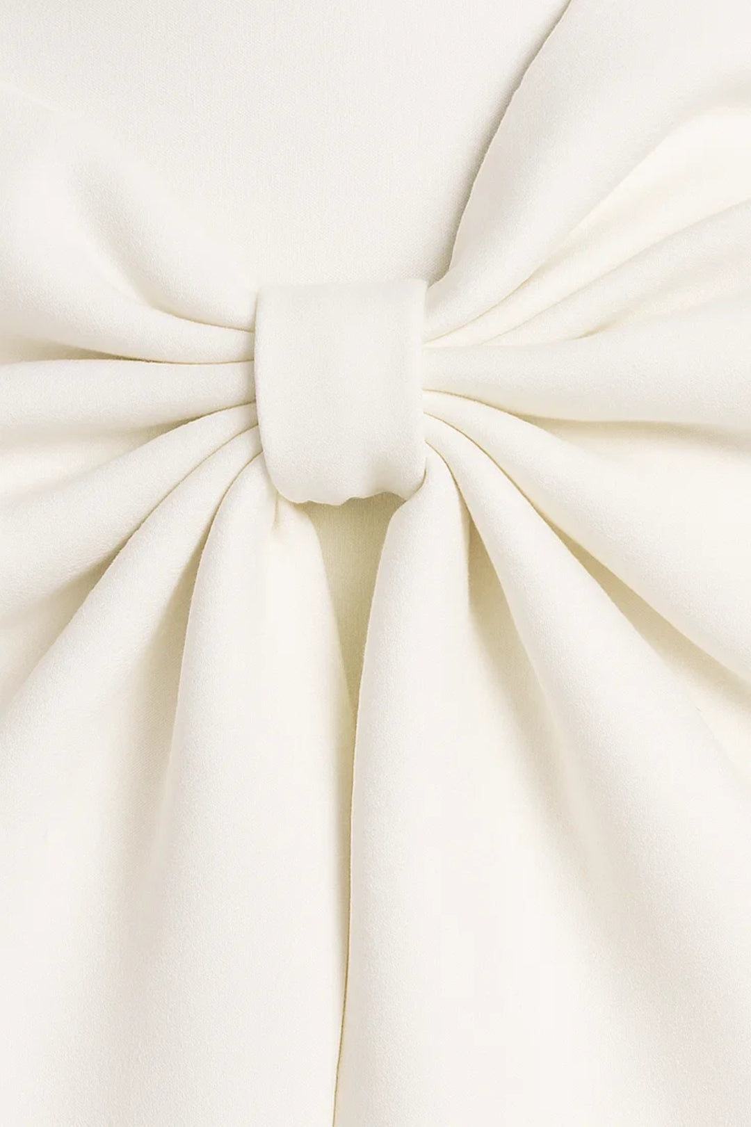 Close-up of the soft gathered bow in cream fabric, tied with a narrow centre loop 2