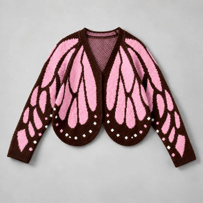 Flat lay of the cardigan in pink and dark brown, with ribbed cuffs and white dotted hem 3