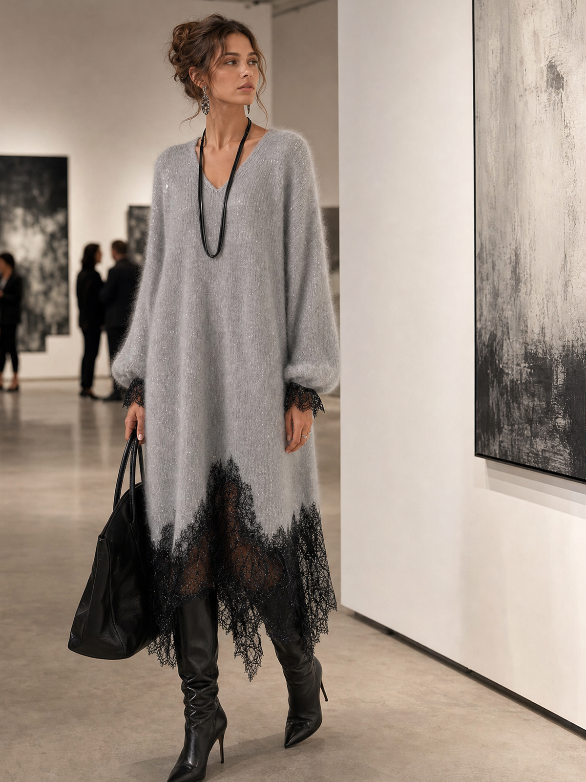 Grey dress worn by a model in a bright art gallery beside large abstract paintings 3