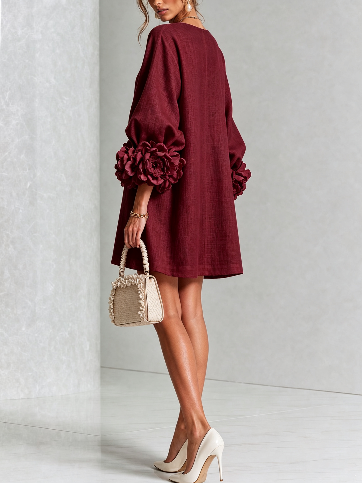 Burgundy dress seen from behind, turning to show the plain back and the dark rose cuffs. 37