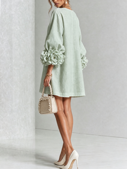 Mint green dress seen from behind, turning to show the plain back and the rose cuffs. 33