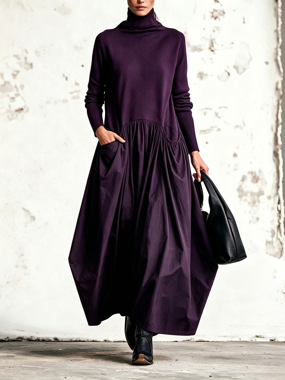 Front view of the dress in deep purple, with the model's hand resting in the pocket 7