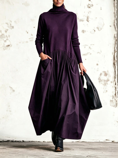 Front view of the dress in deep purple, with the model's hand resting in the pocket 7