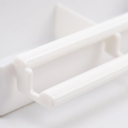 Close-up of the feeder's ridged white plastic perch bars and their bracket, showing the texture and moulded construction. 3