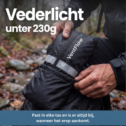 Hands tucking the jacket, packed into its black drawstring pouch with a reflective strip, into a bag on a damp forest path. 10