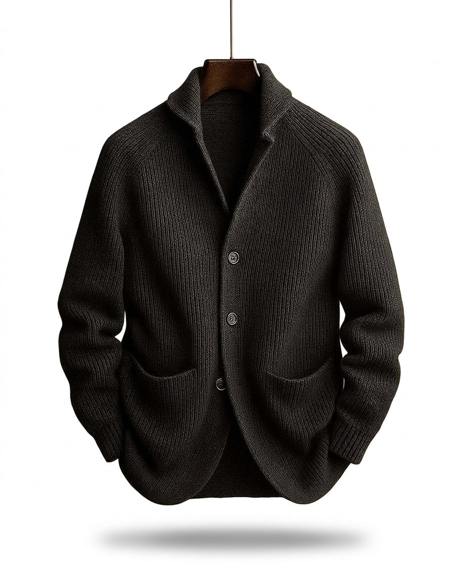 Charcoal-black version of the ribbed shawl-collar cardigan on a wooden hanger, showing three buttons and two front pockets. 2