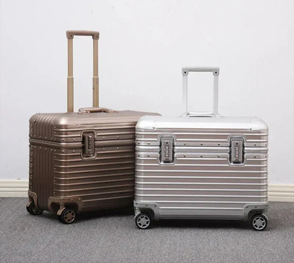 Gold-toned and silver ribbed cases standing together with handles extended against a plain wall 7