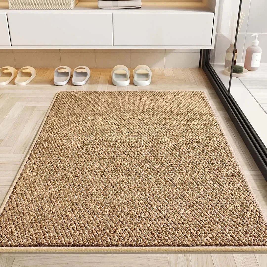 Tan mat on a light wood-effect floor next to a glass shower, with slippers lined up behind 6