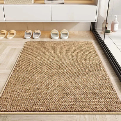 Tan mat on a light wood-effect floor next to a glass shower, with slippers lined up behind 6