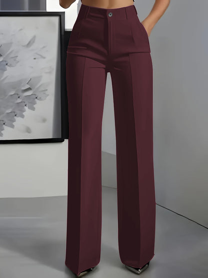 Front view of wide-leg trousers in burgundy with a centre crease, worn with a hand in the pocket 7