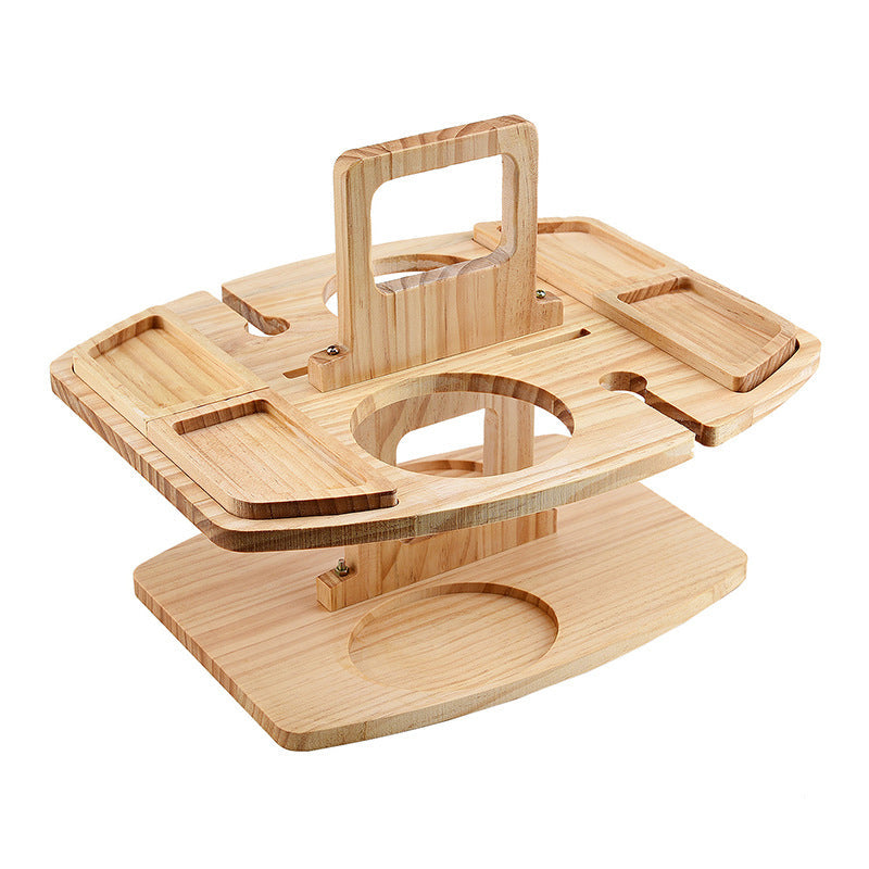 Empty light wooden table opened up, showing the carry handle, snack trays, bottle hole and glass slots 4