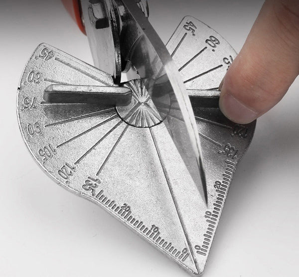 A finger holds the angle guide steady while the blade cuts, showing the degree scale up close 4