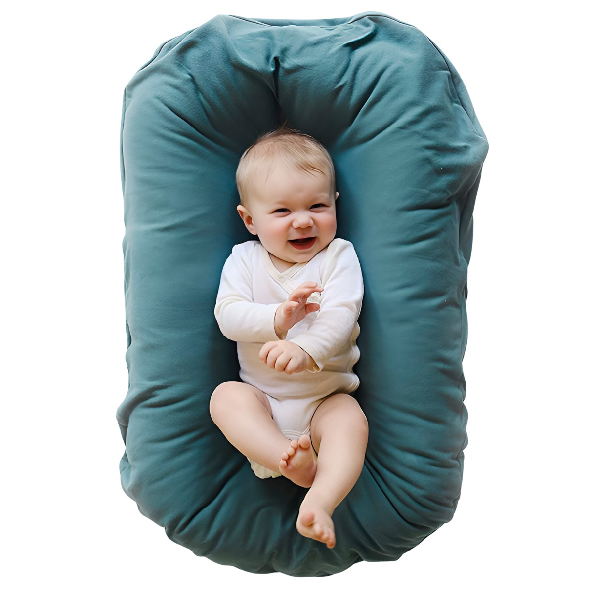 Smiling baby in a white bodysuit lying in a teal lounger, seen from above 2