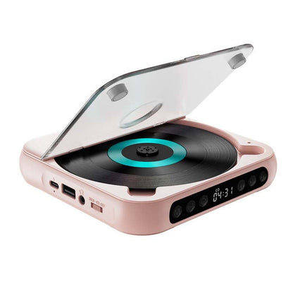 Pink player with lid raised on a white background, showing a turquoise disc ring and the ports on its side. 14