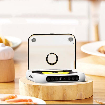 White player with its clear lid upright on a wooden stand, surrounded by plates of food on a table. 7