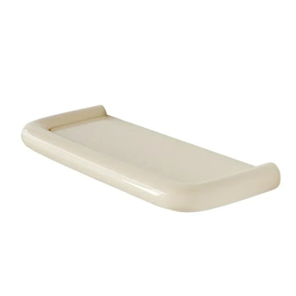 Single empty cream shelf with glossy rounded raised edges, angled view on white background 10