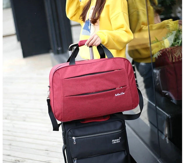 Reversible hand luggage bag