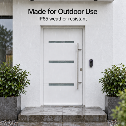 Black doorbell mounted beside a white front door in the rain, showing its outdoor weather resistance 4