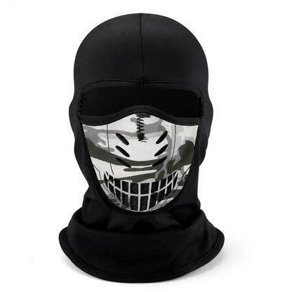 Front view of the black balaclava on a white background, showing the camouflage face panel with oval vents and mesh grille. 6