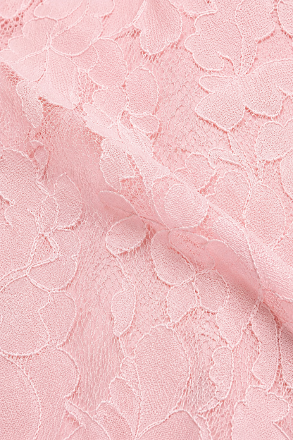 Close-up of soft pink floral lace fabric, showing the raised flower motifs and fine netting texture. 17