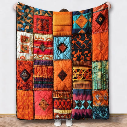 Person holding up a different blanket in orange, red and teal geometric patchwork patterns 3