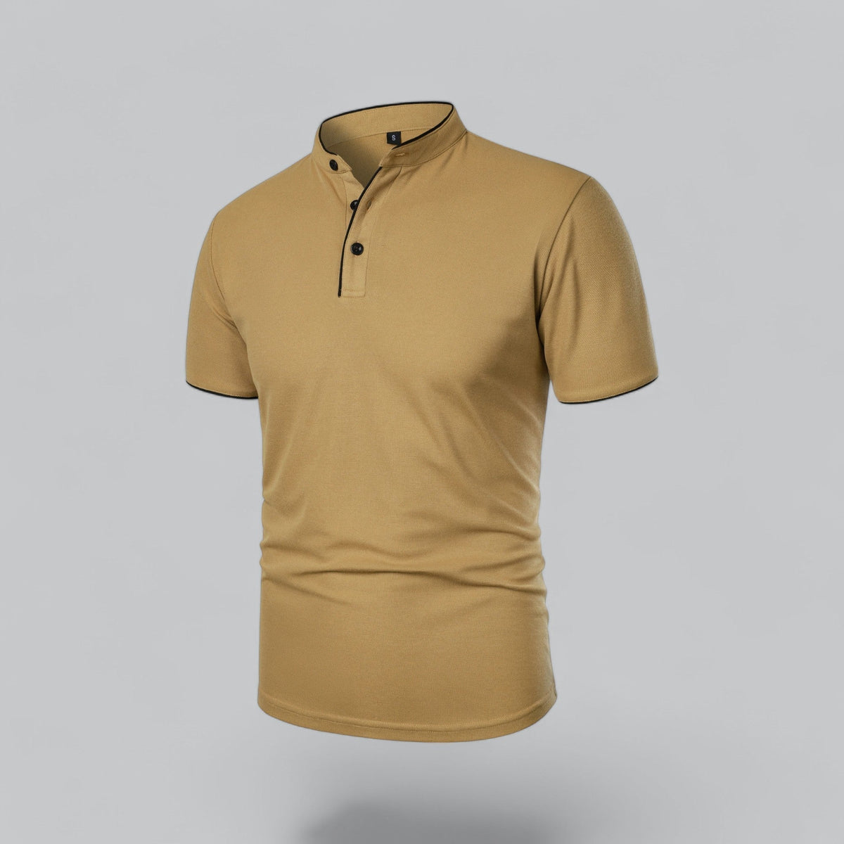Angled three-quarter view of the mustard-tan polo showing the three-button placket and black piping 11