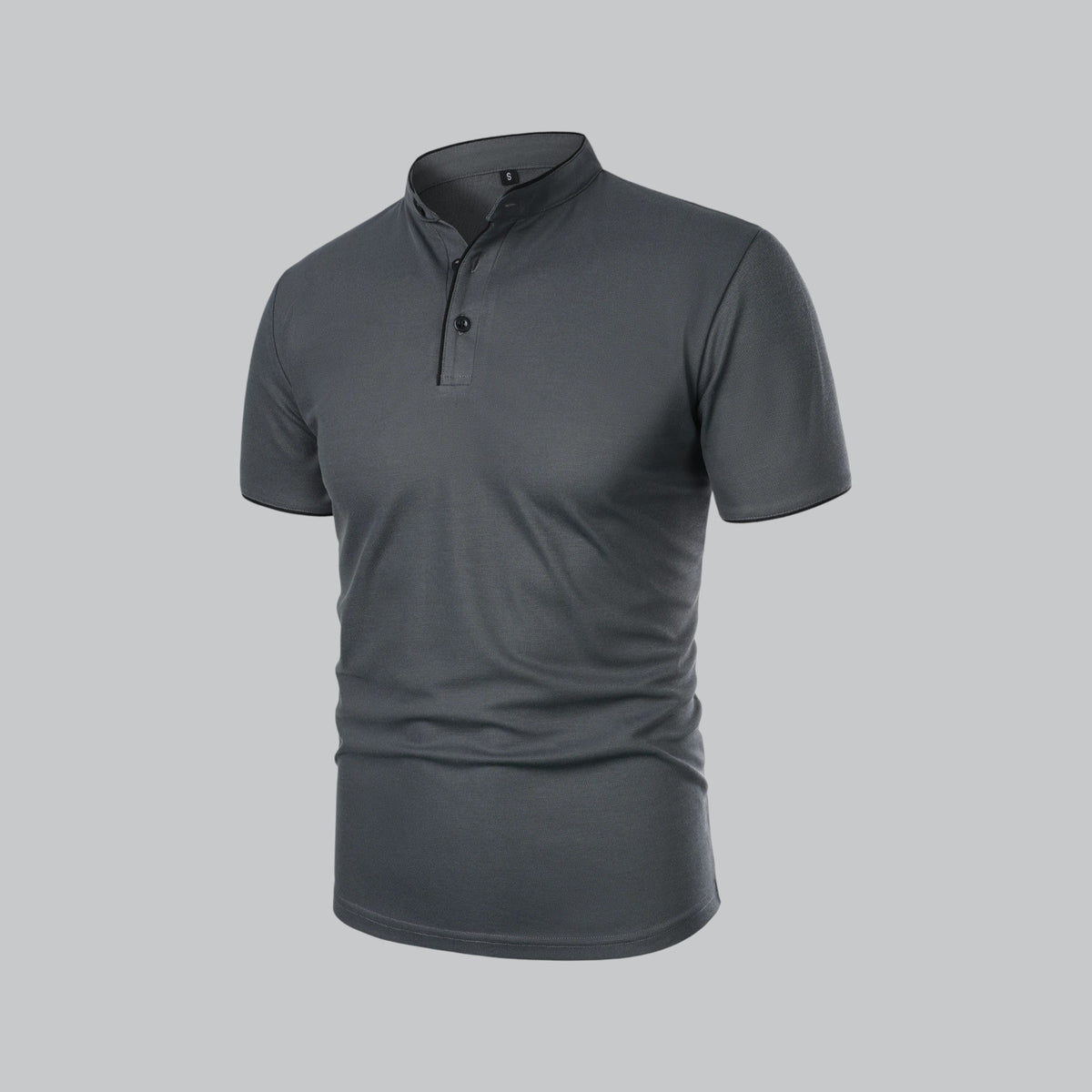 Angled three-quarter view of the dark grey polo showing the black buttons and placket 15