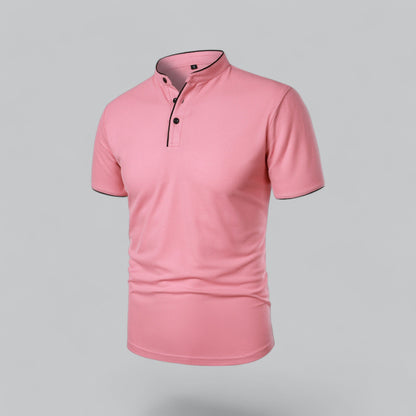 Pink short-sleeved polo seen from the front at an angle, with black buttons and black piped neckband 23