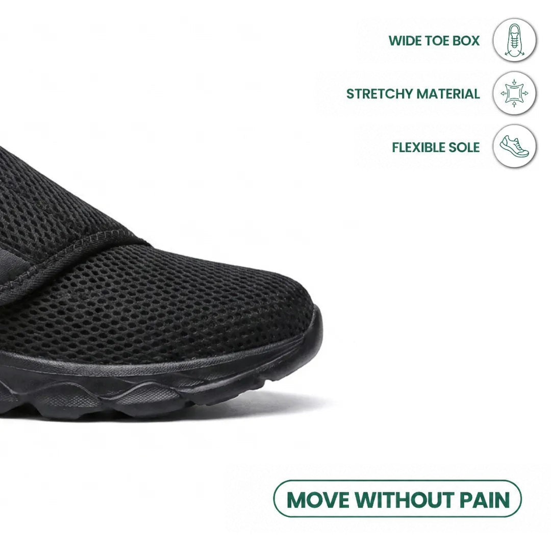 Close-up of the black shoe's wide toe box and sole, with icons for stretchy material and flexible sole. 14
