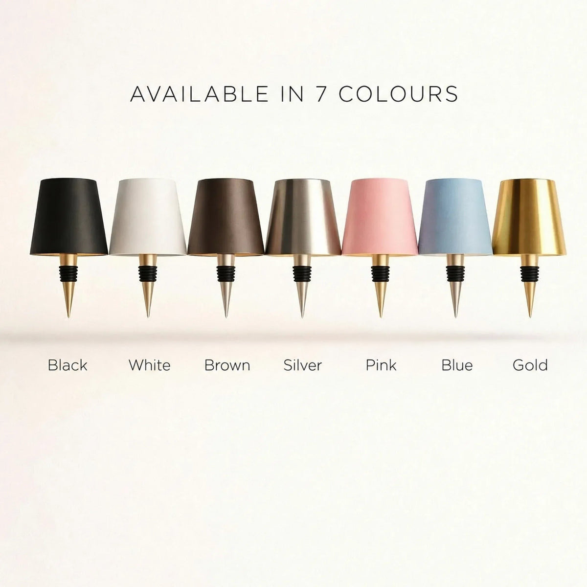 Row of seven lamp shades on stoppers, in black, white, brown, silver, pink, blue and gold 3
